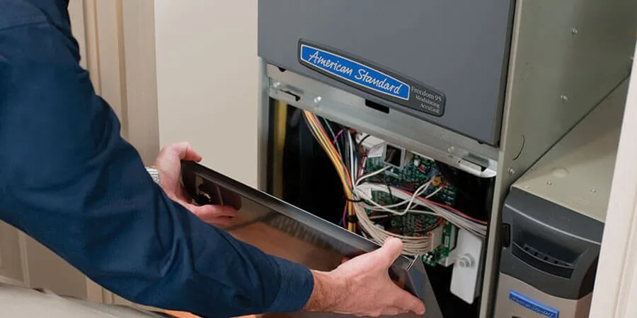 hvac-tech-installing-furnace
