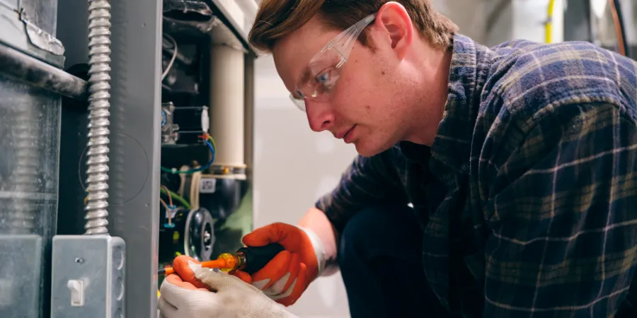 hvac-tech-repairing-furnace